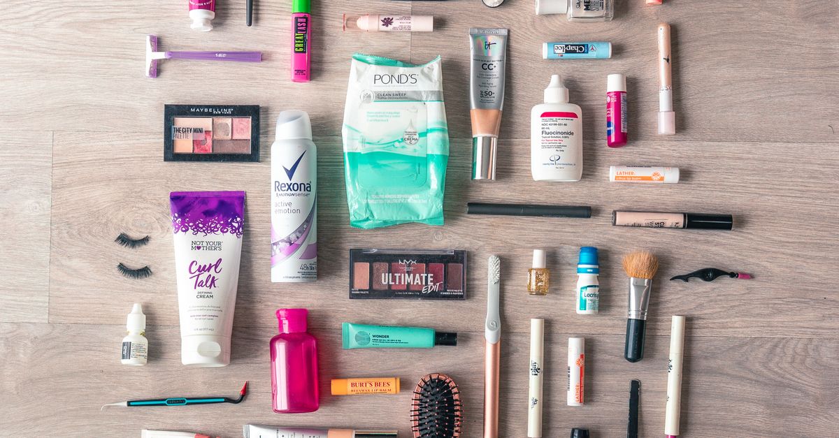 Flat lay of beauty products arranged on a wooden surface, the kind of product photo AI tools can turn into styled scenes