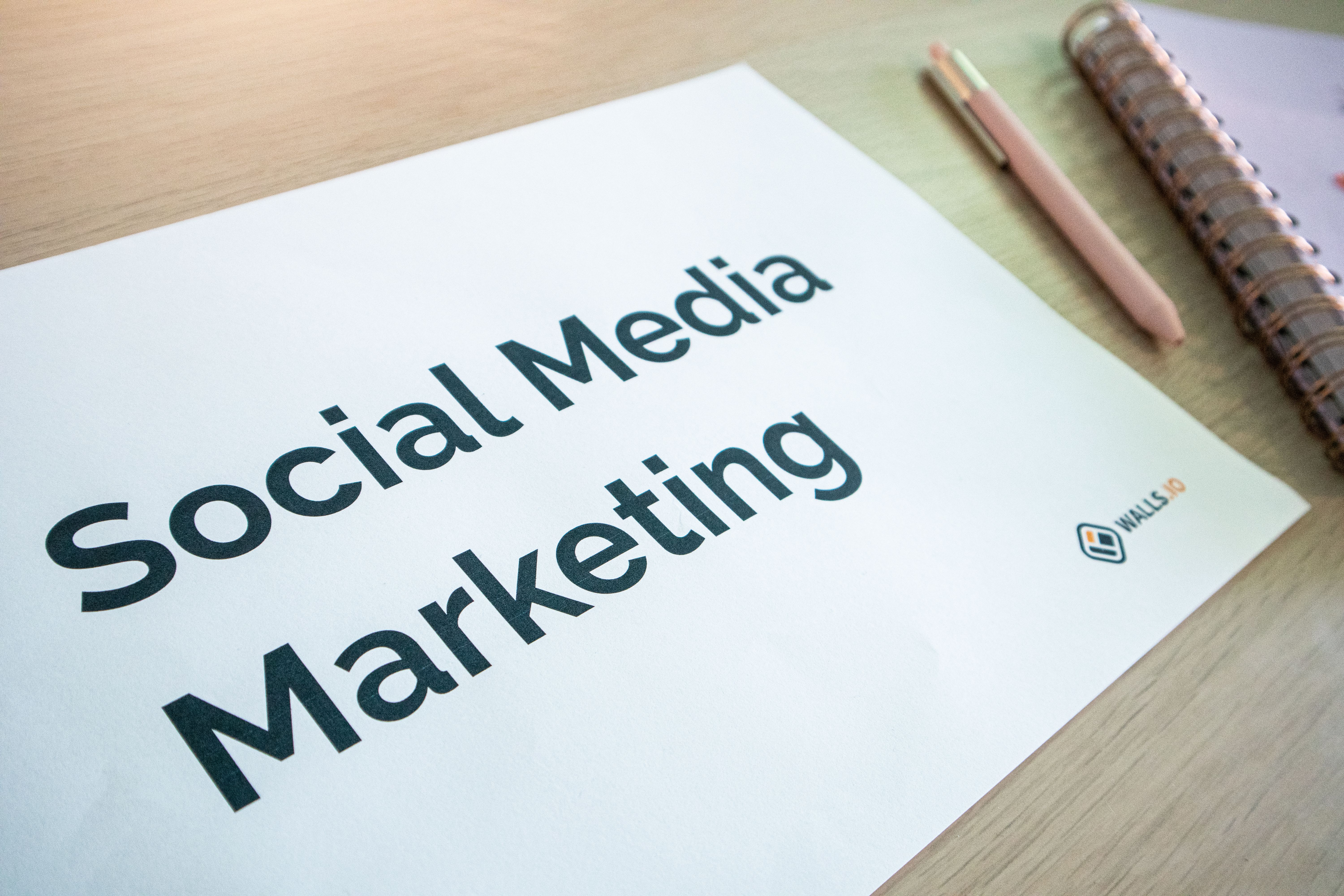 Planning AI social media content creation with a strategy board and laptop on an office desk