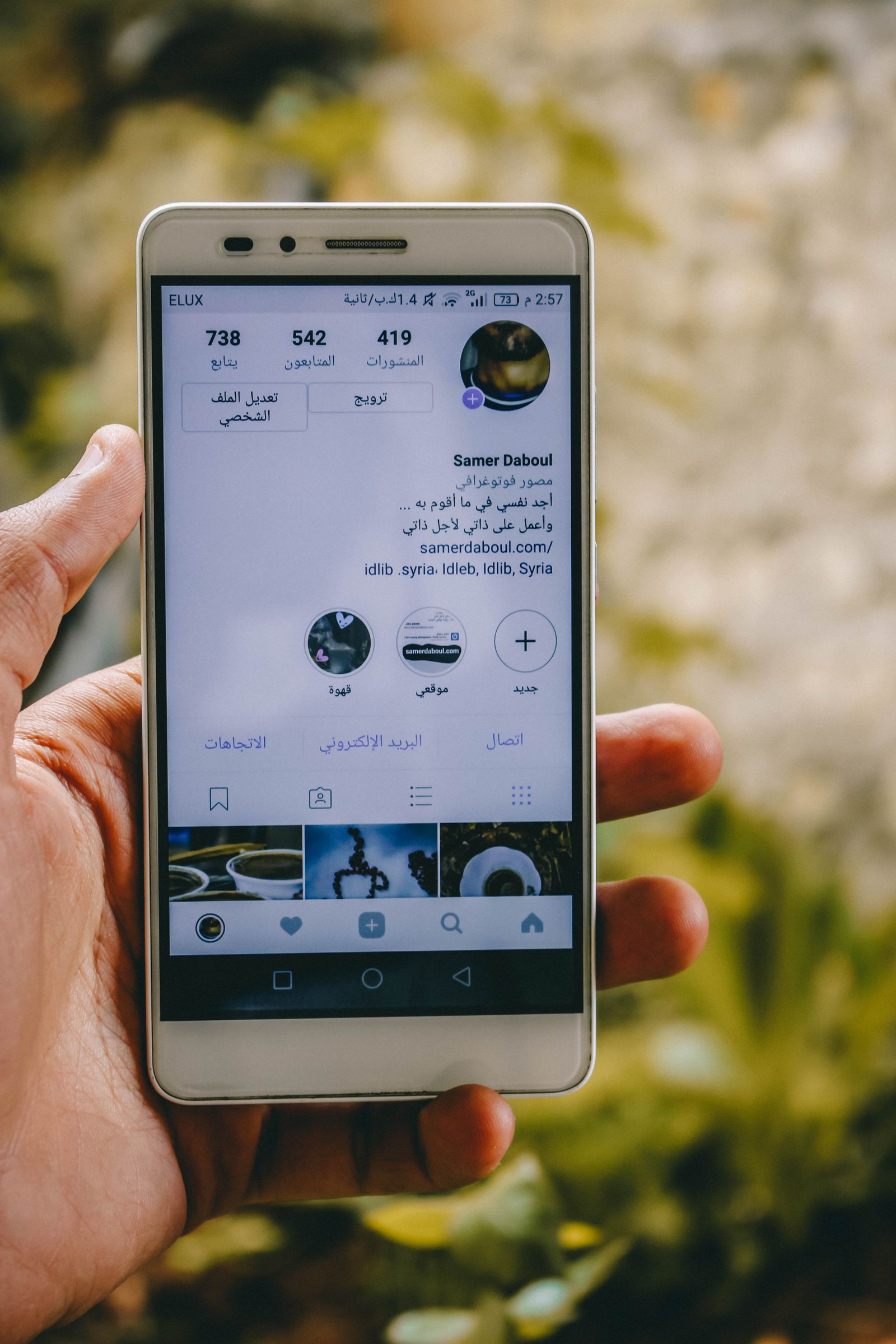Person holding a phone showing Instagram, ready to schedule Instagram Stories