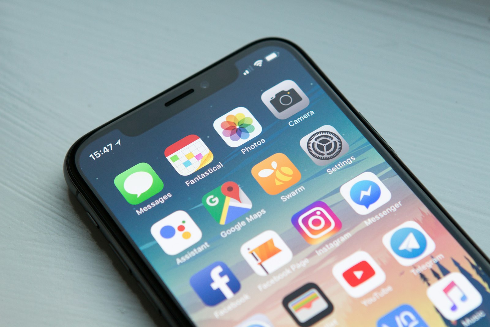 Person typing a message on a smartphone, setting up auto reply on Instagram