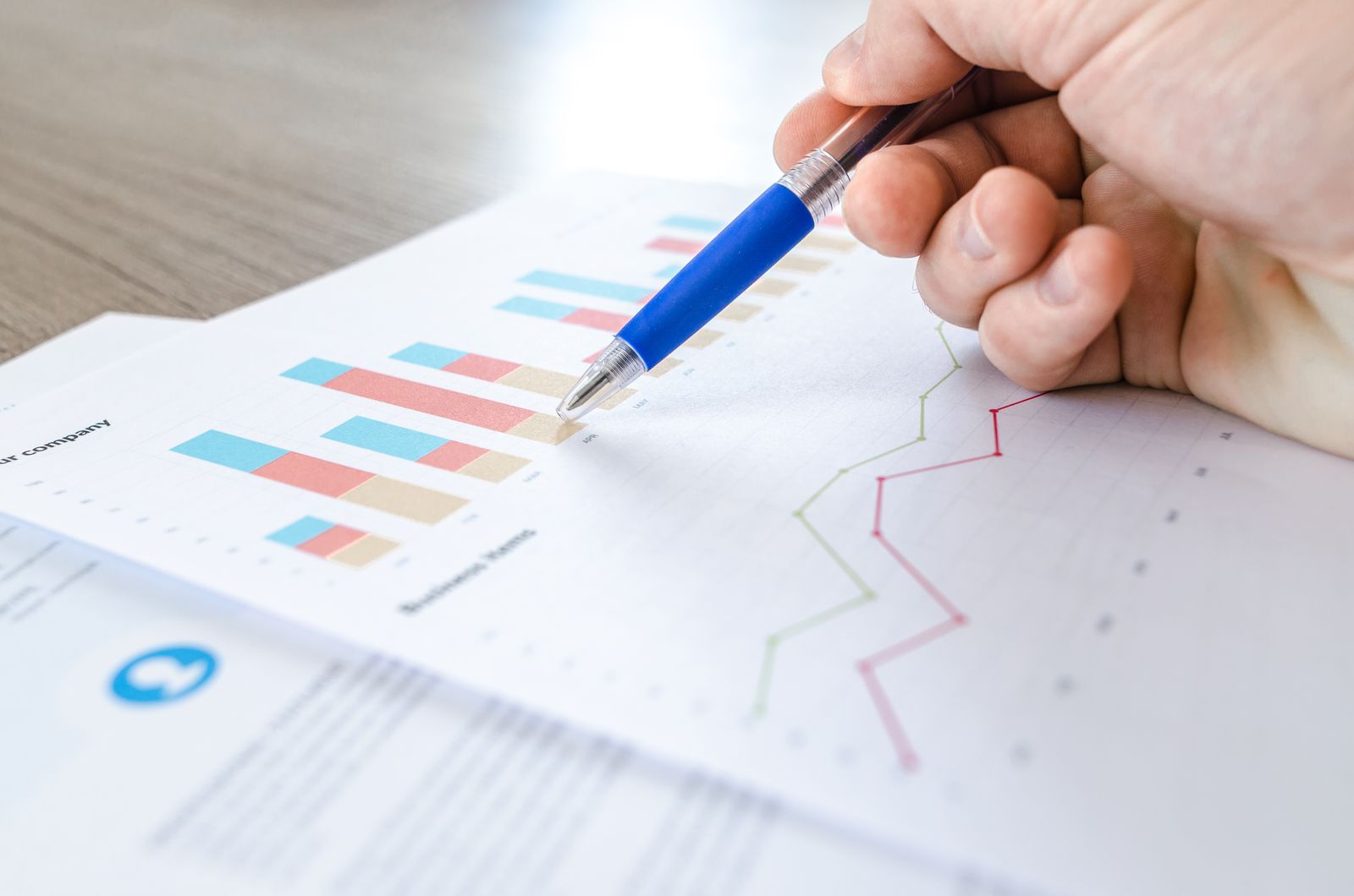 Analyst reviewing social media competitor analysis charts and engagement graphs on a laptop screen