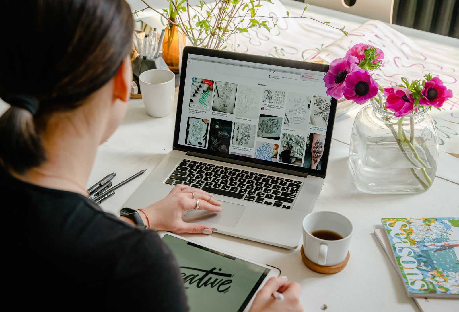 Designer creating social media graphics on a laptop