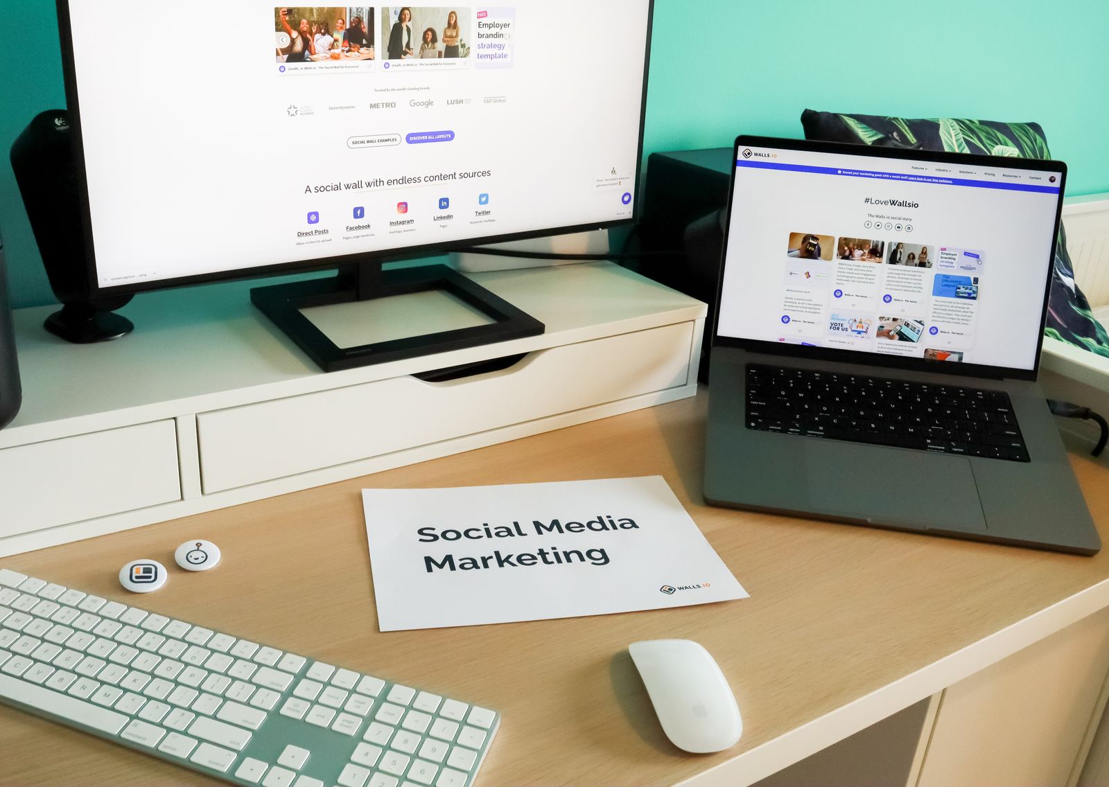 Social media manager's desk with a monitor and laptop, the kind of workflow AI is reshaping
